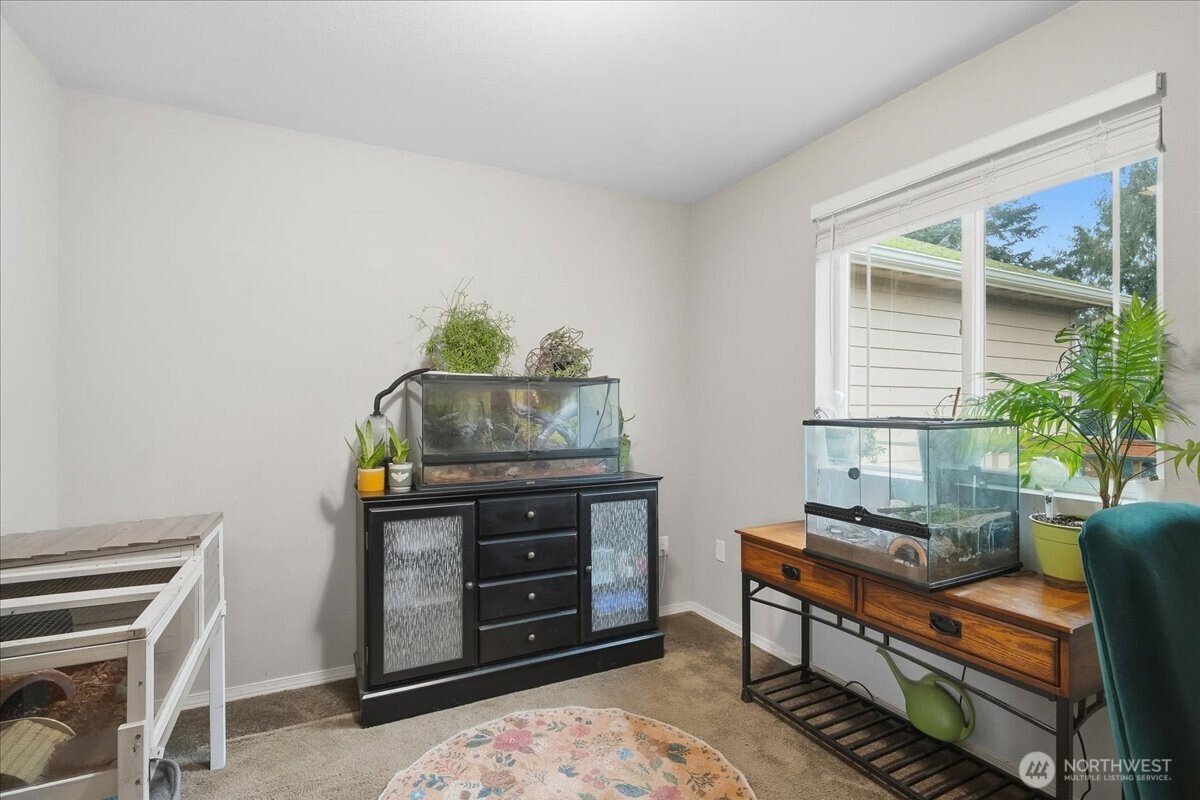 966 South Military Road Winlock, WA 98596 - Photo 13 of 31 a room with furniture and a window