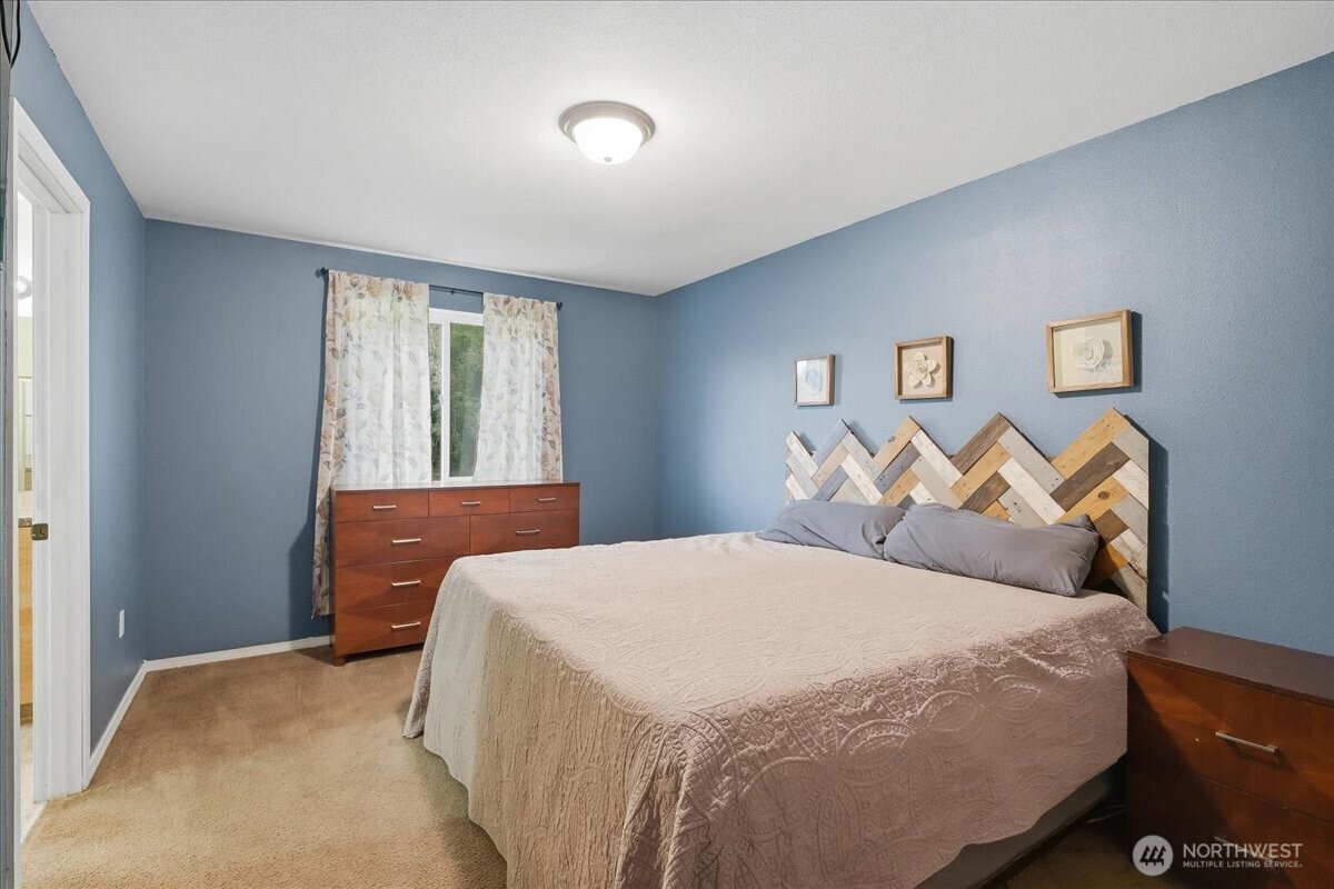 966 South Military Road Winlock, WA 98596 - Photo 15 of 31 a bedroom with a bed and a night stand