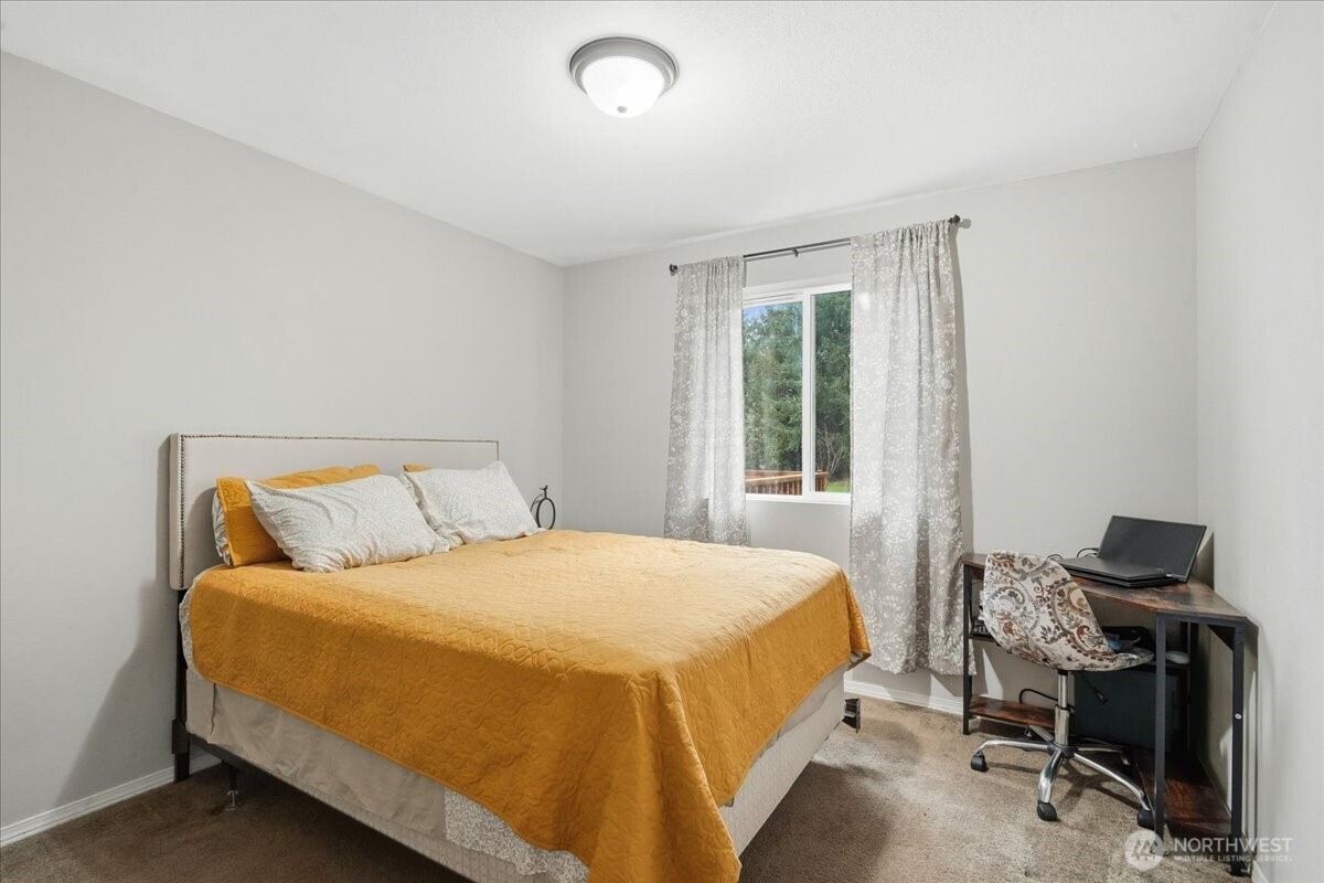 966 South Military Road Winlock, WA 98596 - Photo 22 of 31 a bedroom with a bed and chair