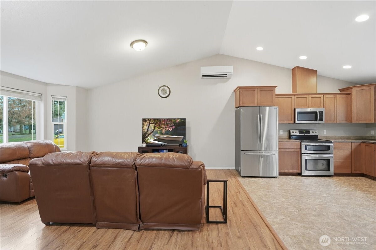 966 South Military Road Winlock, WA 98596 - Photo 7 of 31 a living room with stainless steel appliances furniture and a refrigerator