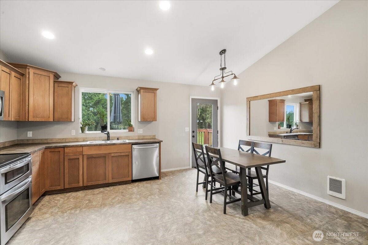 966 South Military Road Winlock, WA 98596 - Photo 8 of 31 a kitchen with a table and chairs in it