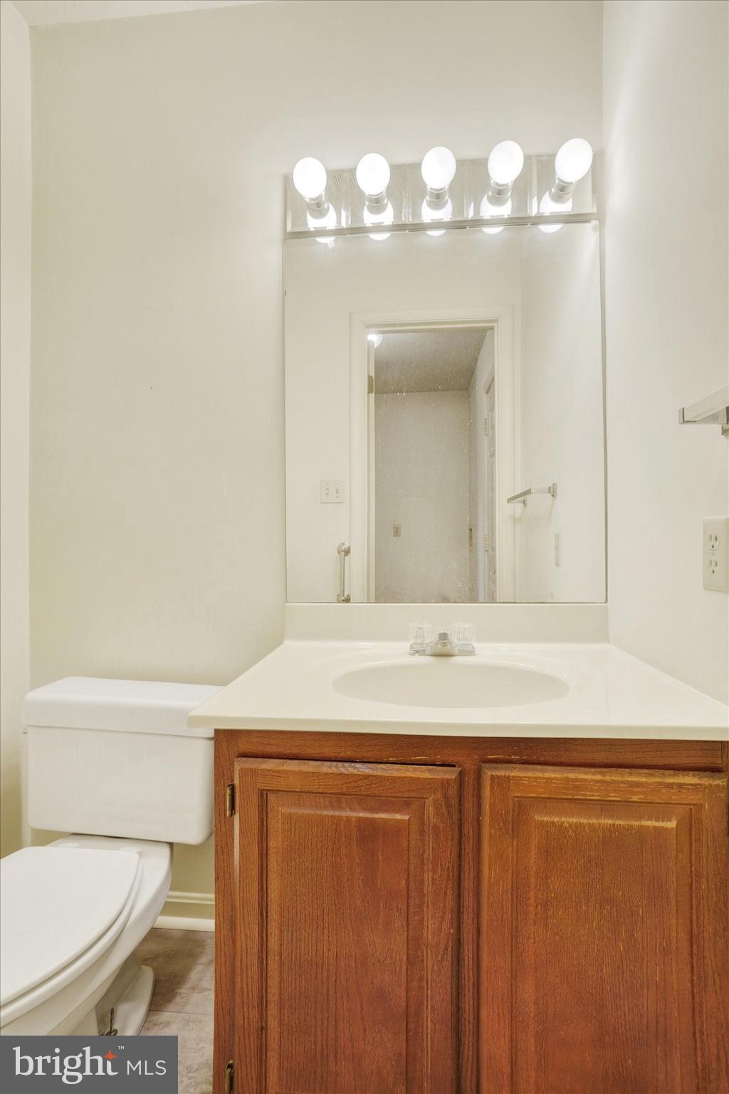 25 Jean Lo Way York, PA 17406 - Photo 13 of 27 a bathroom with a sink a toilet and a mirror