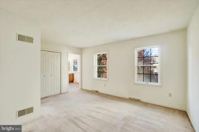 an empty room with windows