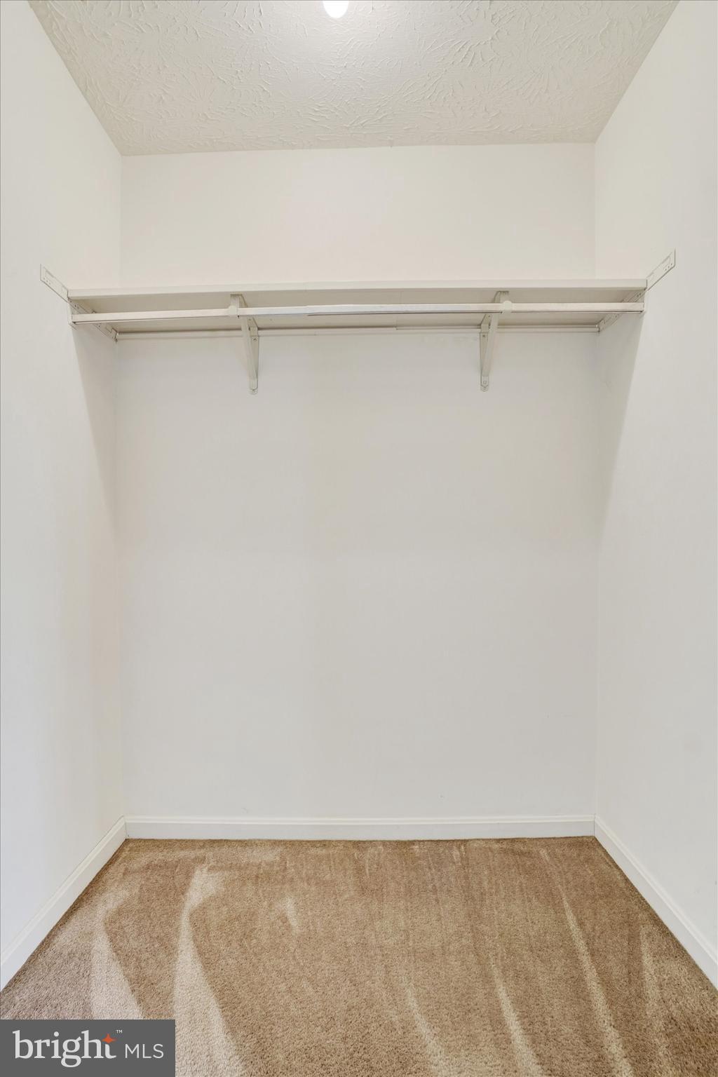 25 Jean Lo Way York, PA 17406 - Photo 19 of 27 a view of a closet with wooden floor