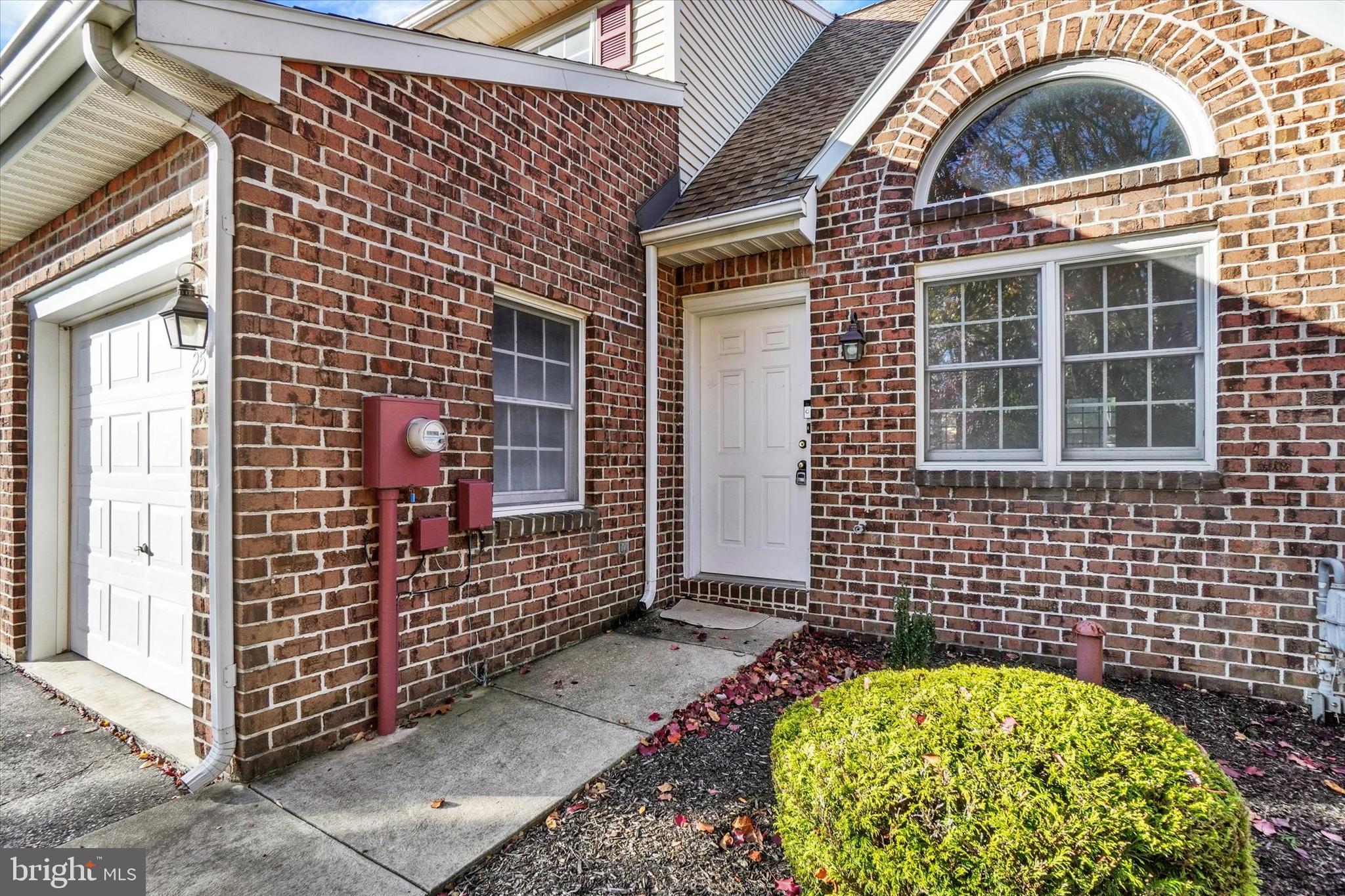 25 Jean Lo Way York, PA 17406 - Photo 3 of 27 a view of a brick house with a wooden door