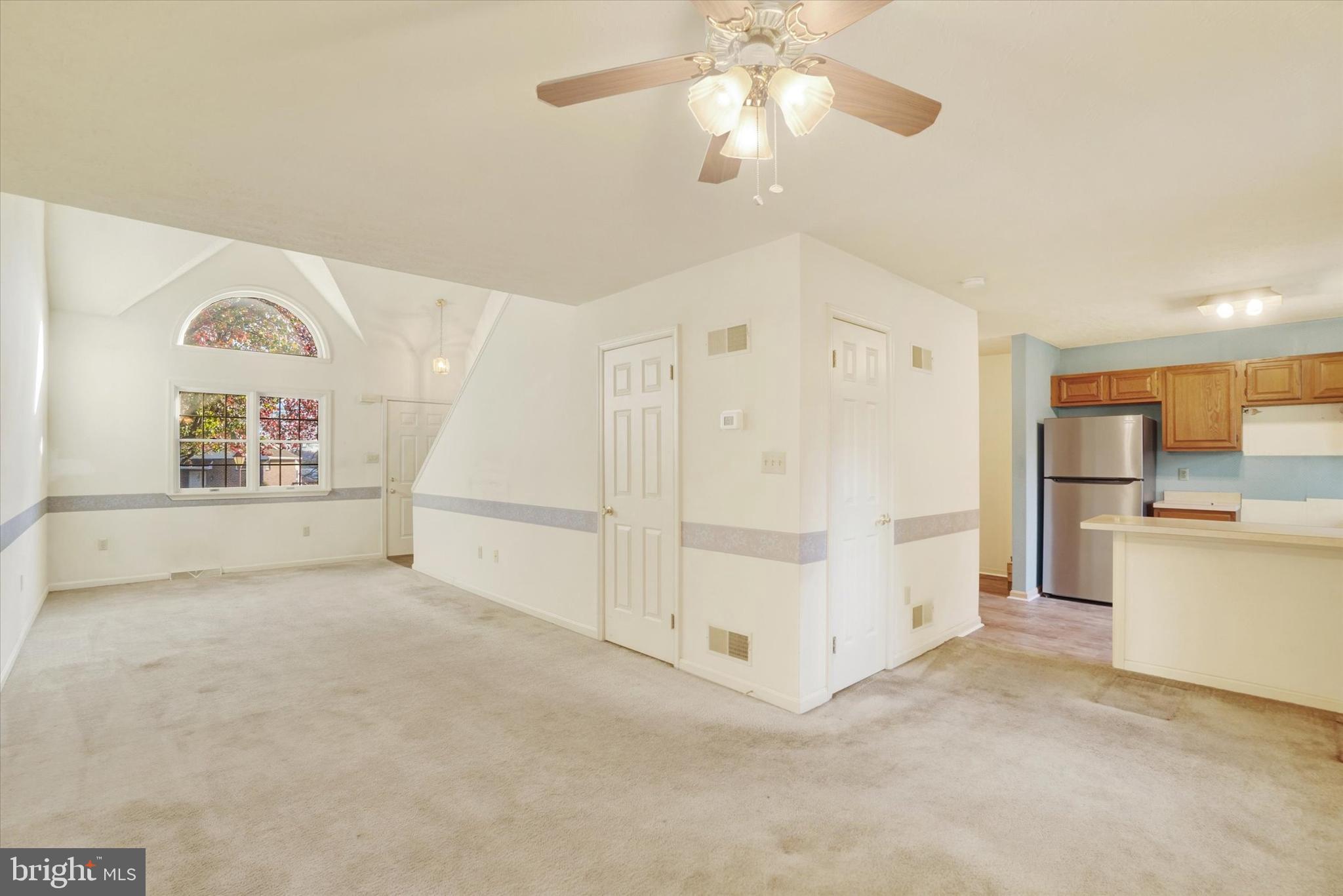 25 Jean Lo Way York, PA 17406 - Photo 7 of 27 a view of a kitchen with furniture and a ceiling fan