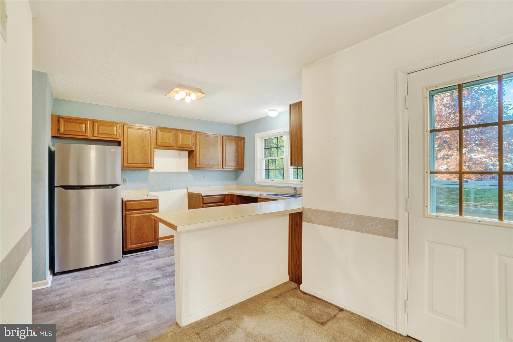 25 Jean Lo Way York, PA 17406 - Photo 9 of 27 a kitchen with stainless steel appliances a refrigerator and a stove