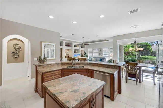 a kitchen with a table and chairs in it