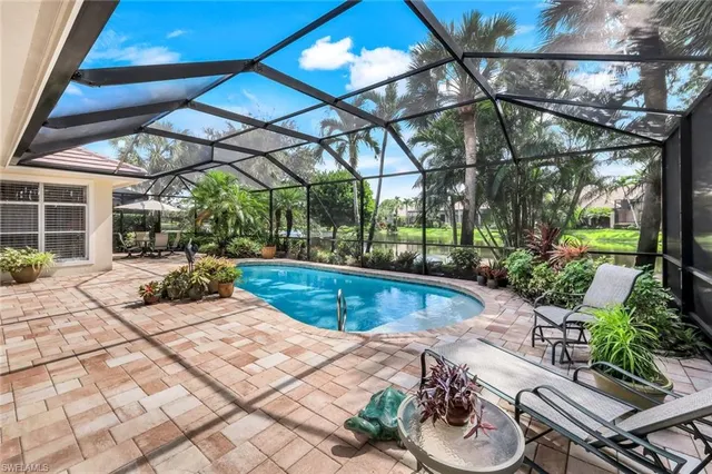 a view of a swimming pool with a patio