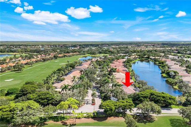 an aerial view of a house with a ocean view