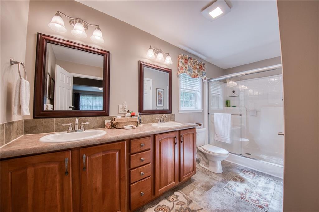 201 Magill Road Zelienople, PA 16063 - Photo 20 of 46 En suite full master bath with double sinks and step-in shower.