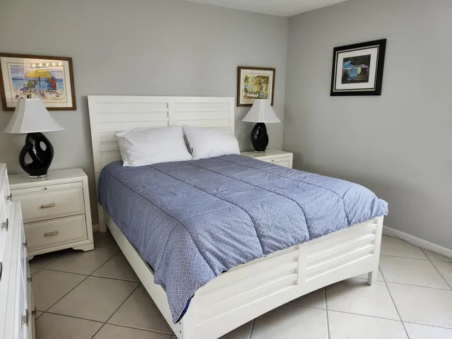 a bedroom with a bed and a cabinets