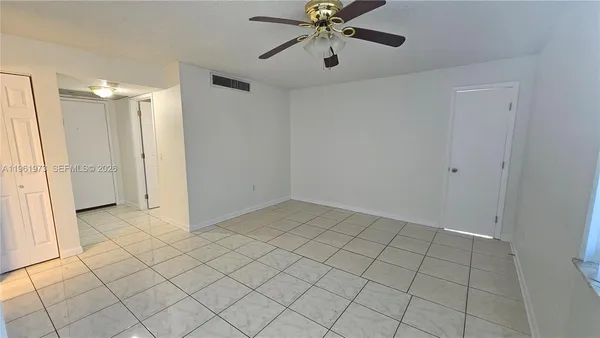 a view of an empty room and window