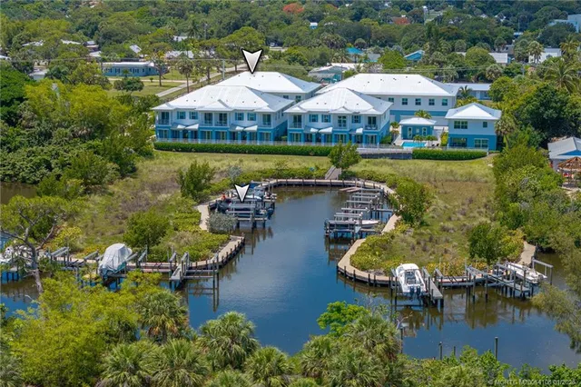 an aerial view of a house with swimming pool and outdoor space