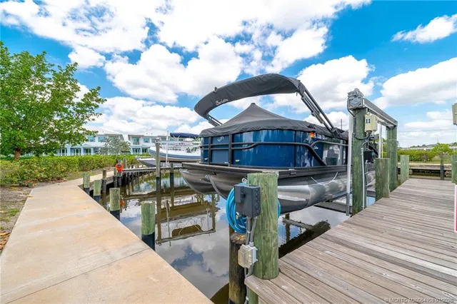 a view of a house with wooden deck