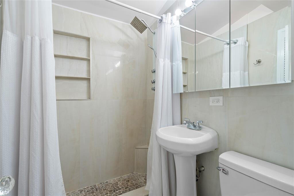 321 Forsyth Street Boca Raton, FL 33487 - Photo 11 of 20 a bathroom with a sink toilet and shower