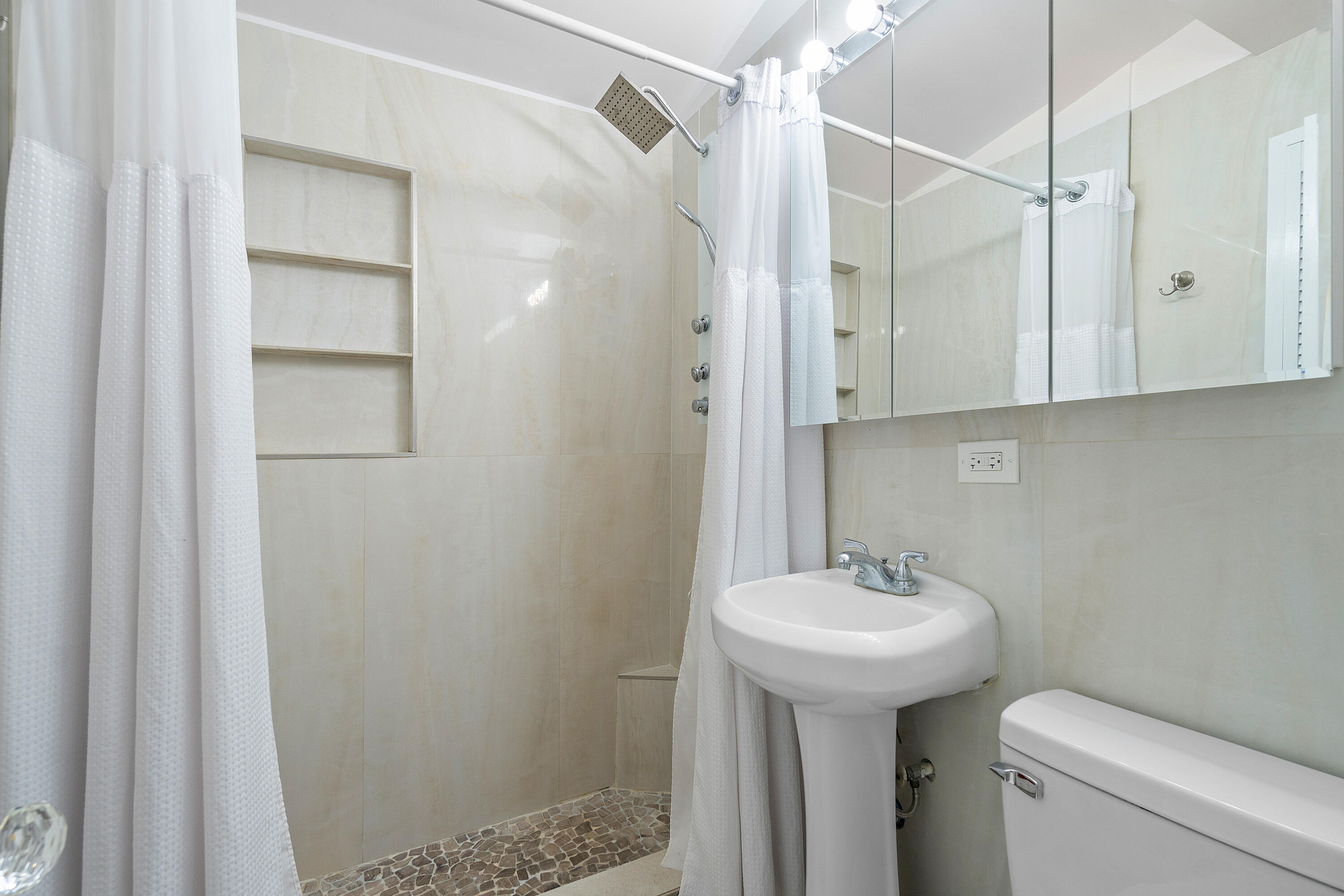 321 Forsyth Street Boca Raton, FL 33487 - Photo 18 of 20 a bathroom with a sink toilet and shower
