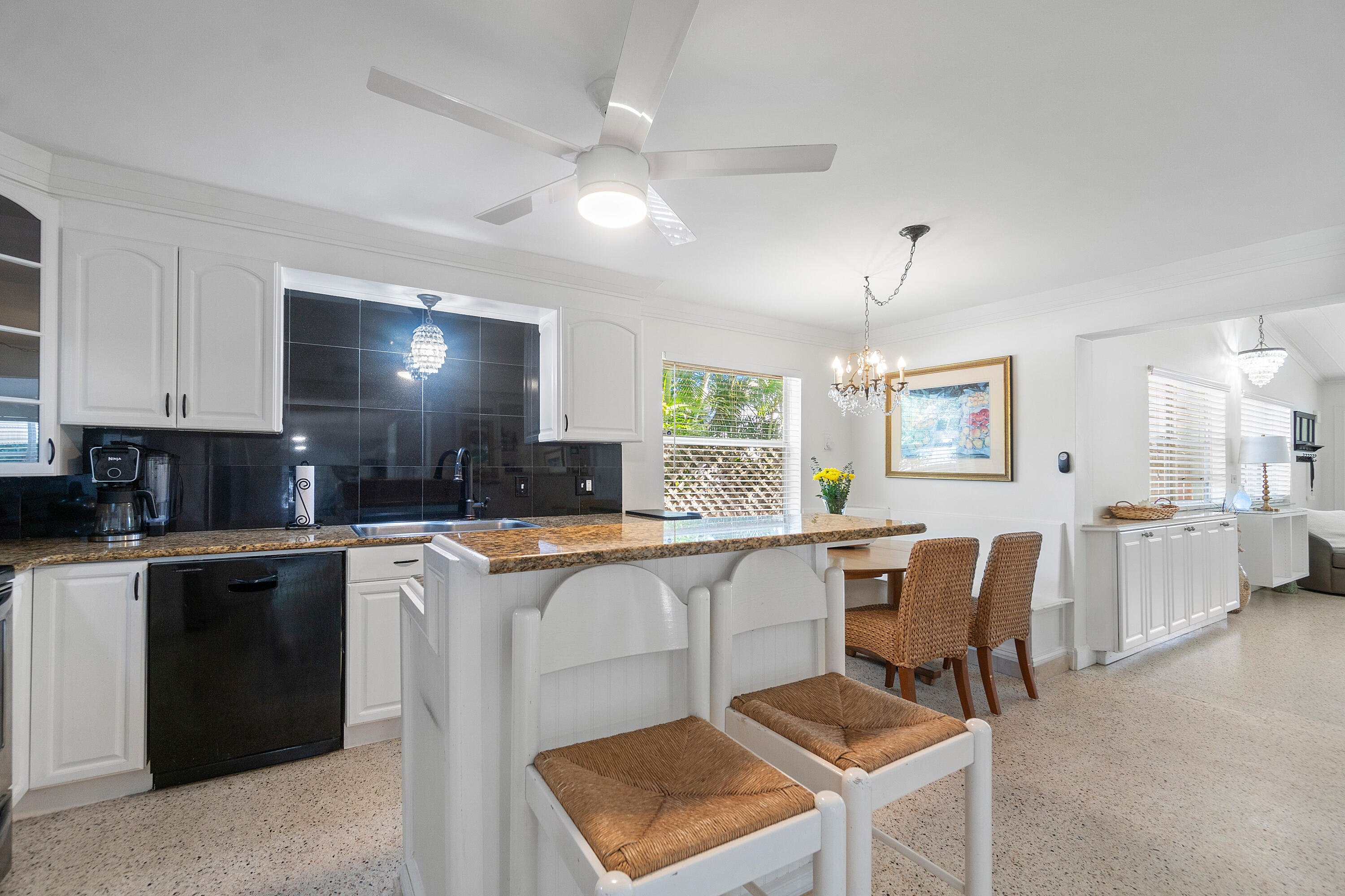 321 Forsyth Street Boca Raton, FL 33487 - Photo 6 of 20 a kitchen with cabinets and chairs
