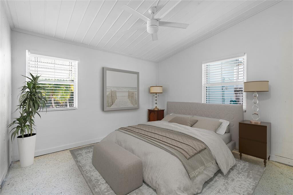 321 Forsyth Street Boca Raton, FL 33487 - Photo 10 of 20 a bedroom with a bed and a potted plant