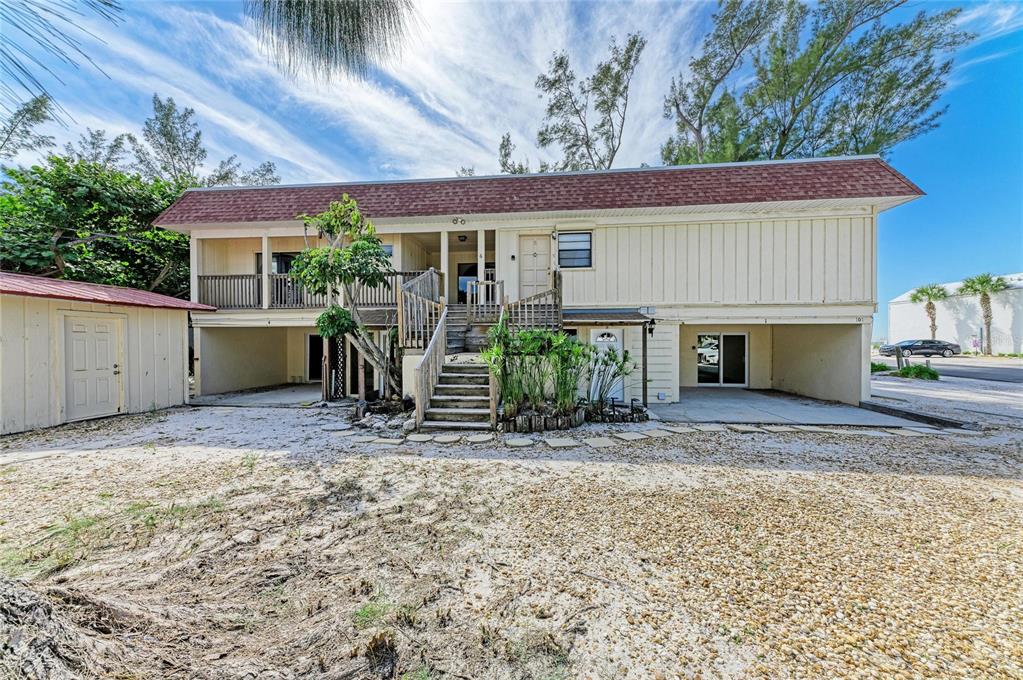 101 73rd Street, Unit 6 Holmes Beach, FL 34217 - Photo 10 of 56 a view of a house with garden and plants