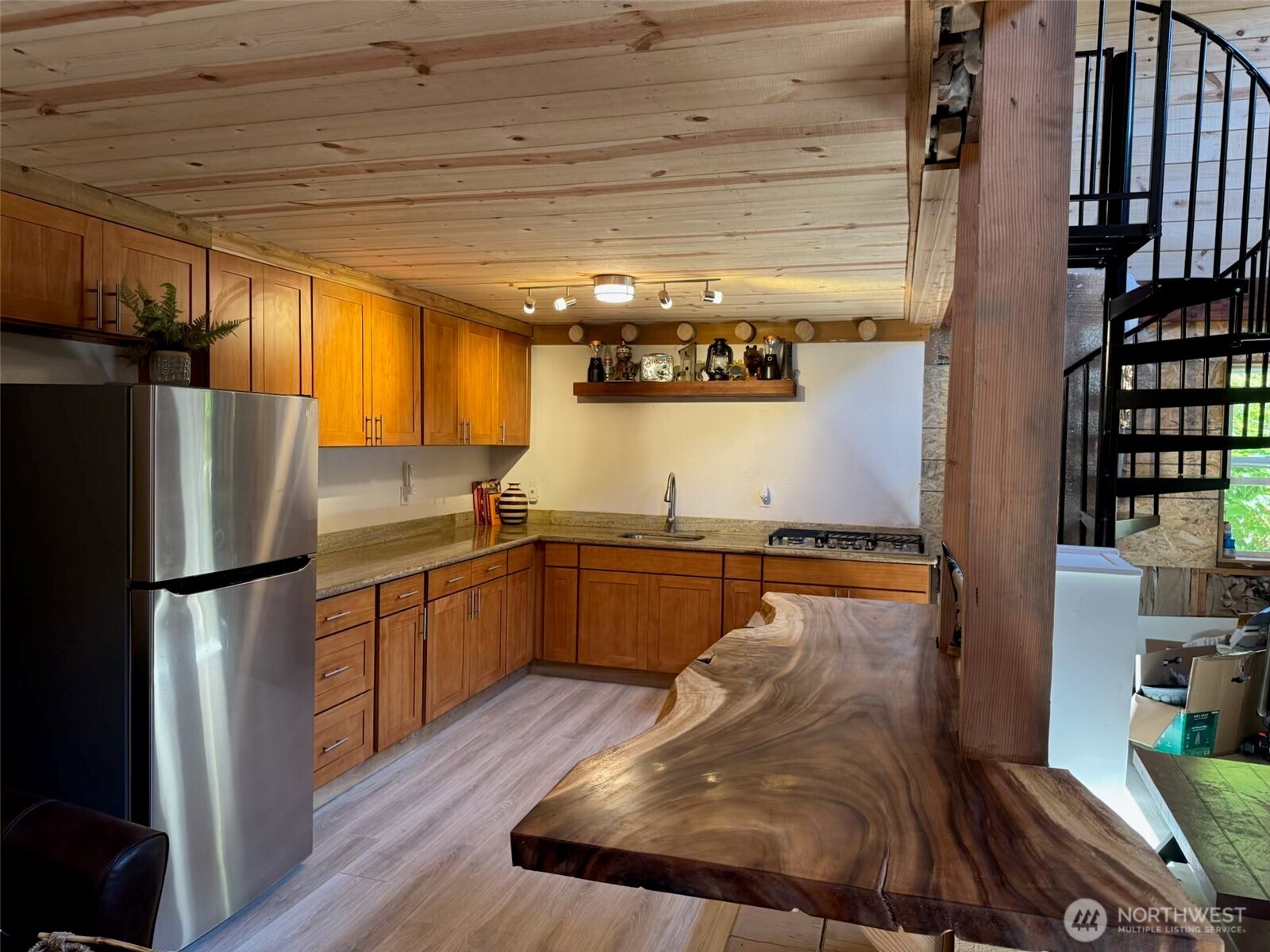 15305 Index-Galena Road Index, WA 98256 - Photo 20 of 40 a kitchen with stainless steel appliances granite countertop a refrigerator a stove and a wooden floors