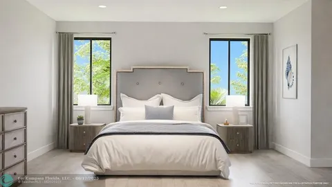 a bathroom with a double vanity sink a mirror and a bathtub