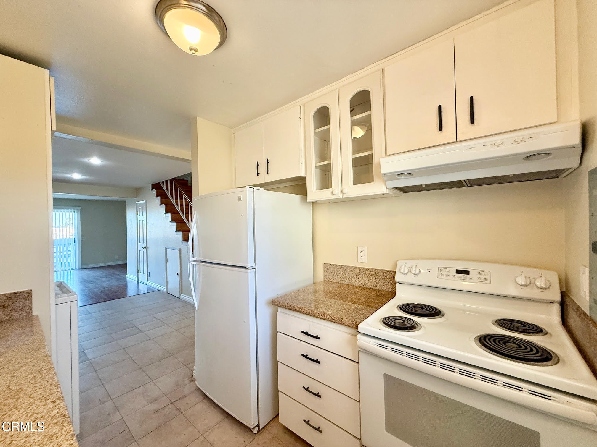 259 South Ventura Road, Unit 254 Port Hueneme, CA 93041 - Photo 14 of 30 a kitchen with a stove cabinets and utility