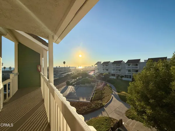an aerial view of residential building and ocean