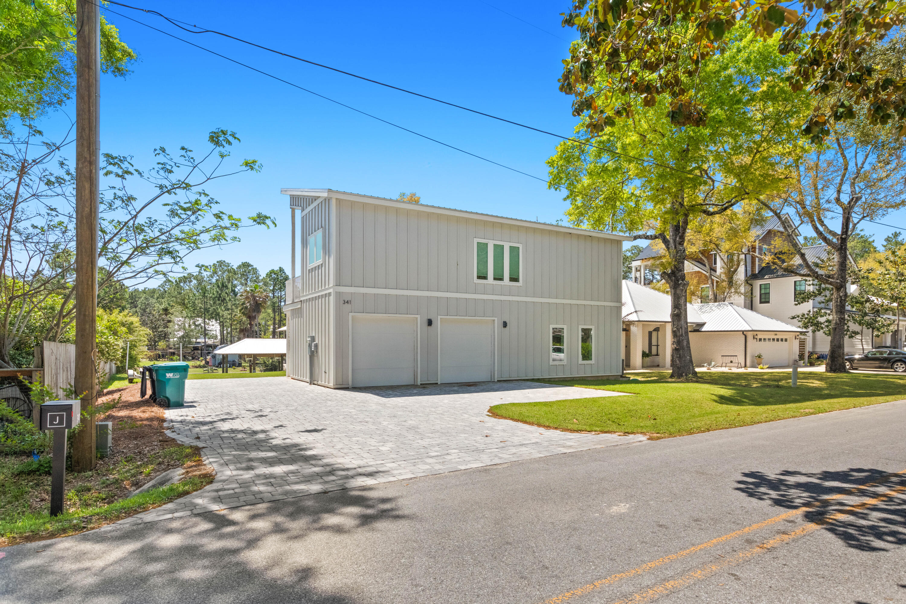 341 Little Canal Drive Santa Rosa Beach, FL 32459 - Photo 17 of 27 a white house with a large tree and yard in front of it