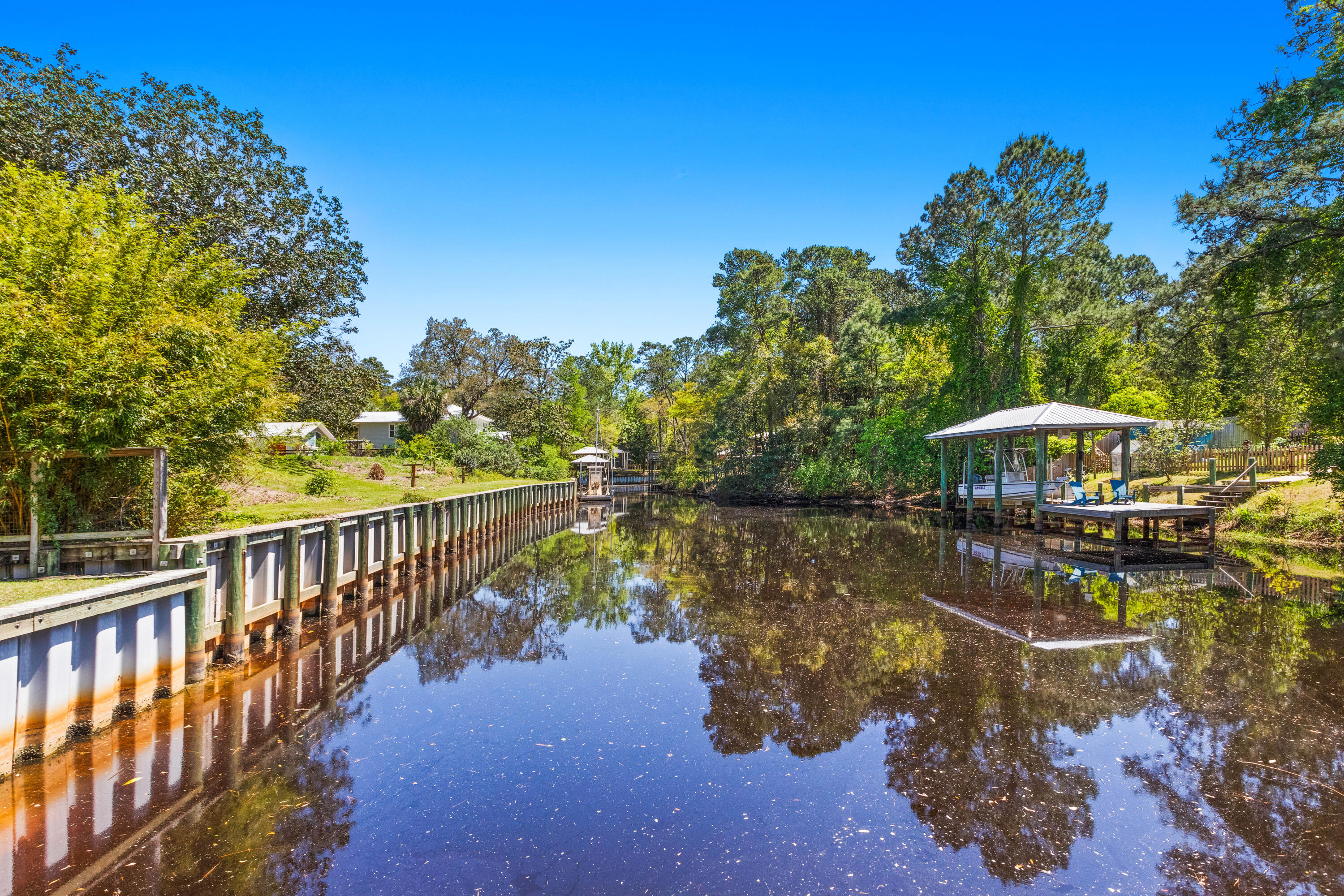 341 Little Canal Drive Santa Rosa Beach, FL 32459 - Photo 24 of 27 a view of a lake with a garden