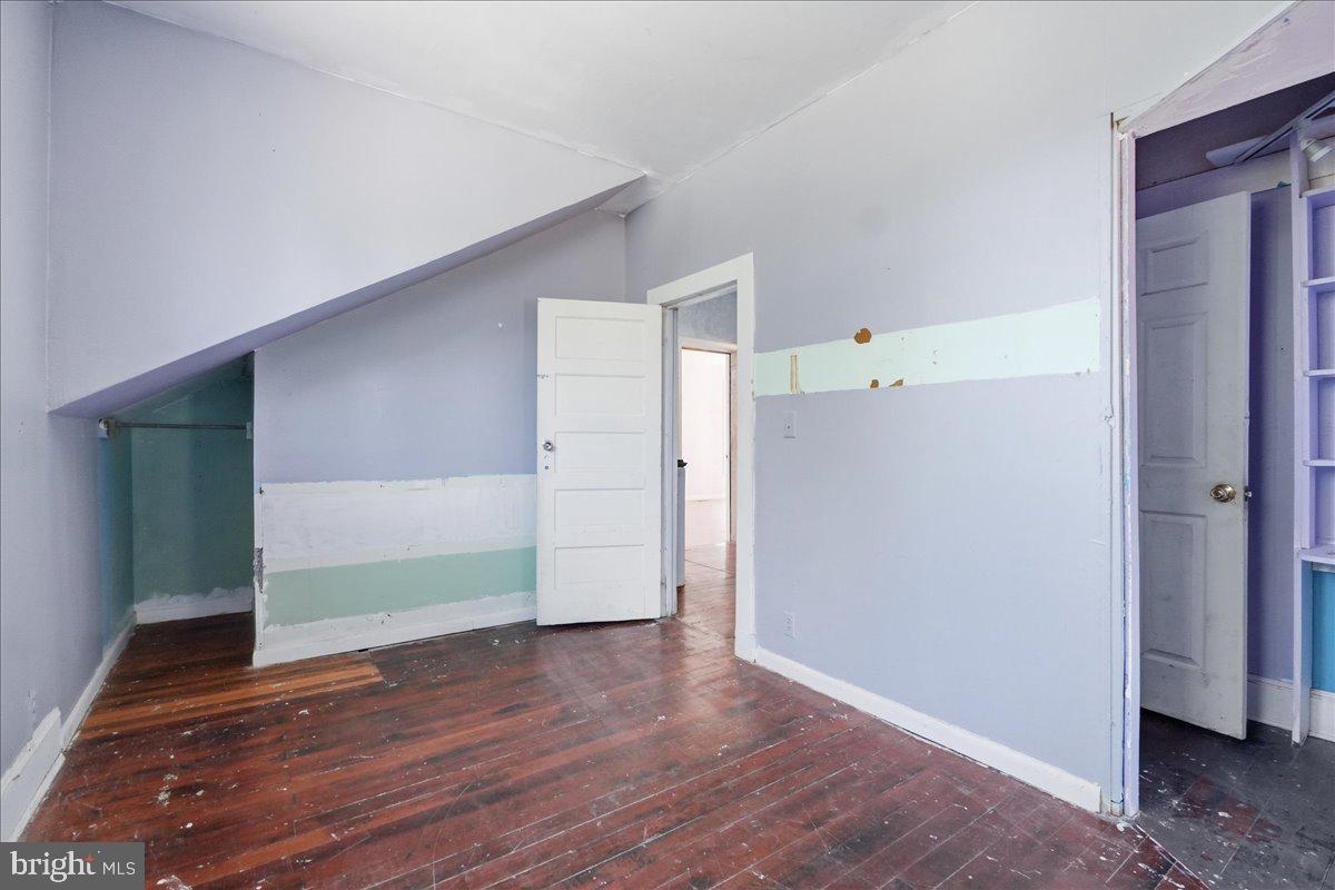 73 Church Road Arnold, MD 21012 - Photo 22 of 29 a view of an empty room with wooden floor
