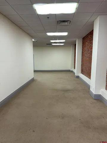 an empty room with closet and cabinet