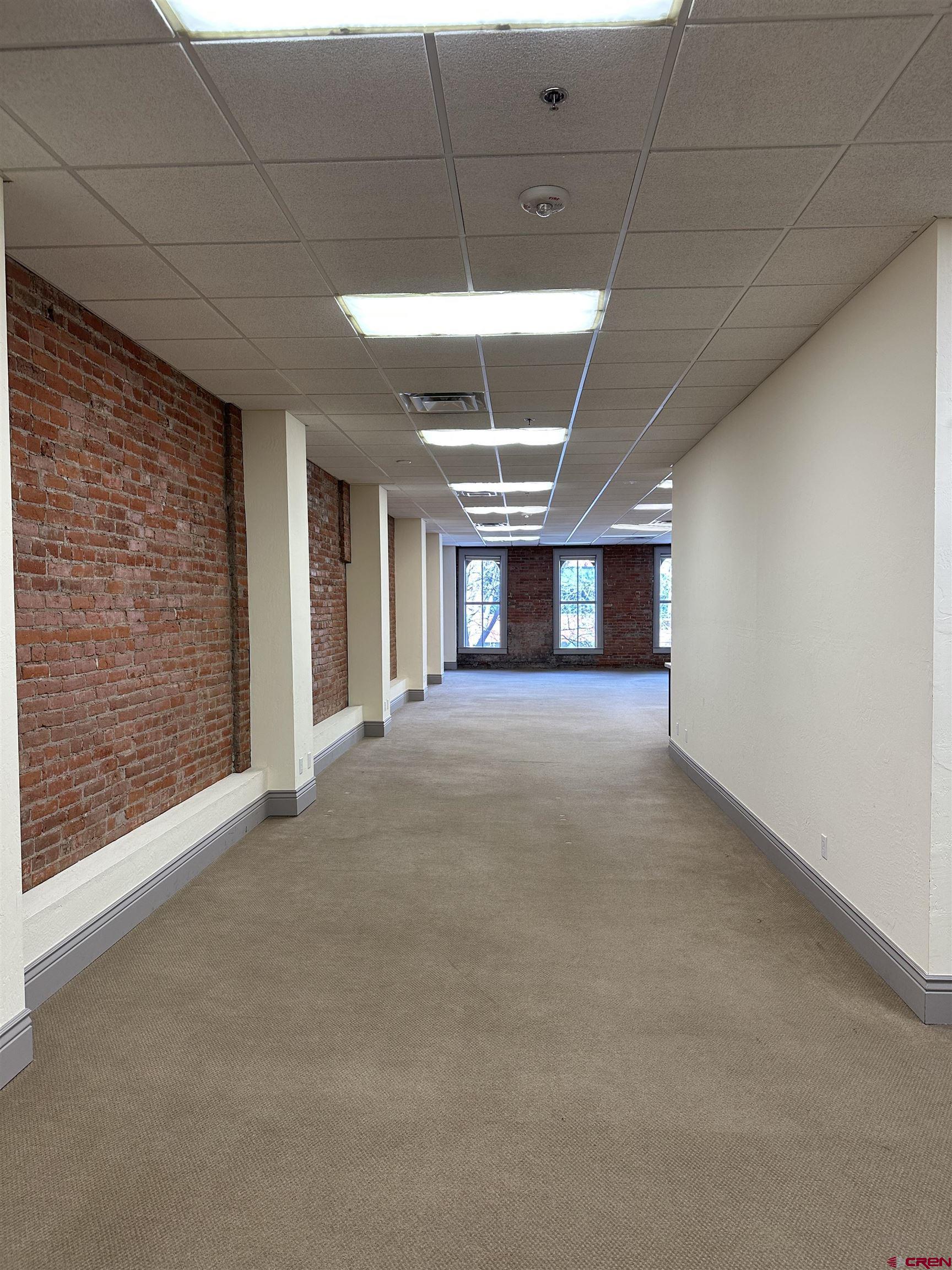 858 Main Avenue, Unit 202 Durango, CO 81301 - Photo 3 of 12 a view of empty room with a ceiling fan