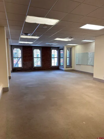 a view of an empty room with windows