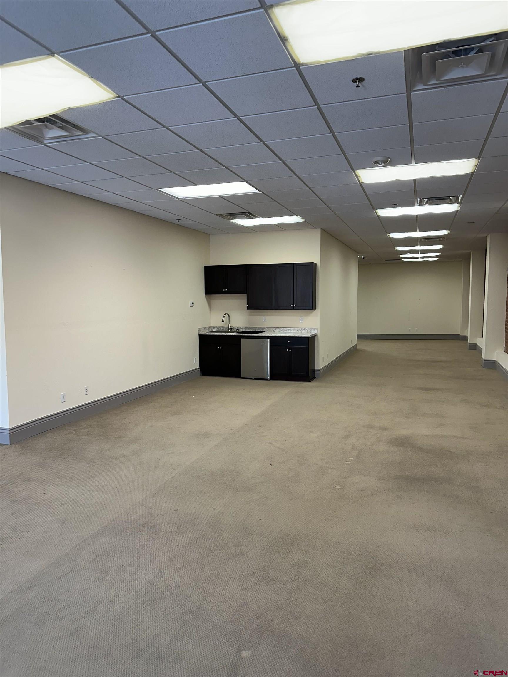 858 Main Avenue, Unit 202 Durango, CO 81301 - Photo 8 of 12 a view of a livingroom with a projector & furniture