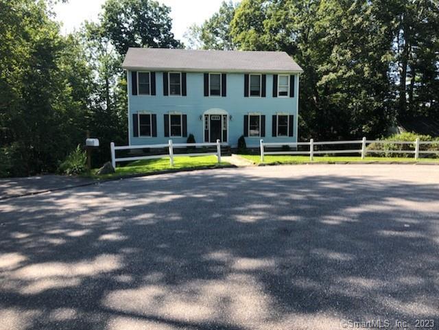 a view of a house with a swimming pool and porch