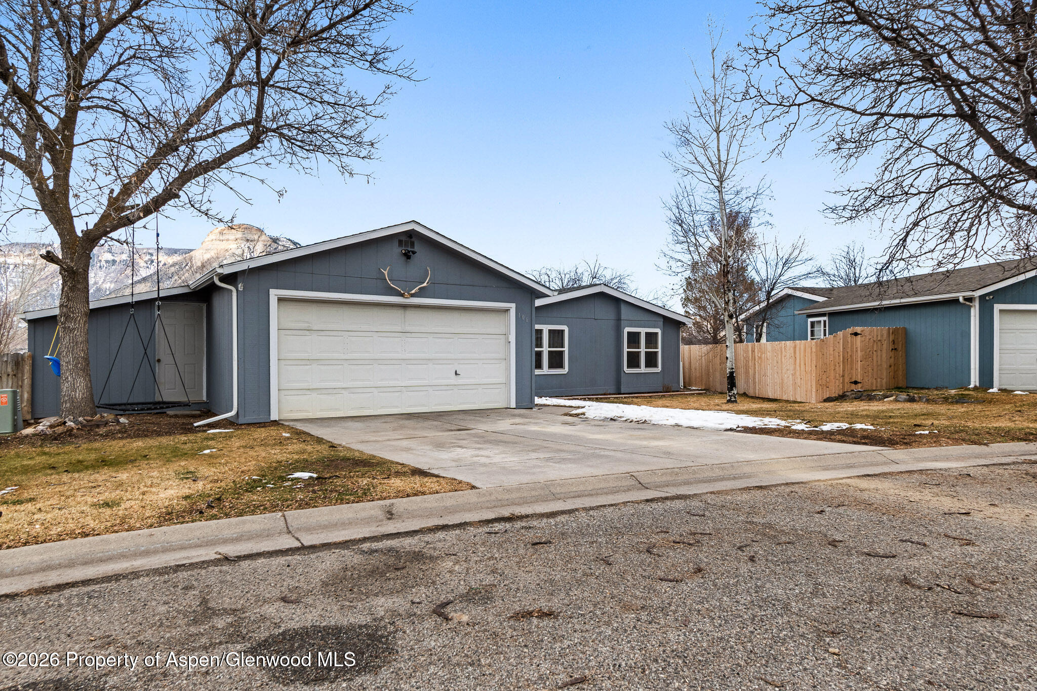 106 Cedar Circle Parachute, CO 81635 - Photo 3 of 35 a view of a house with a yard and garage