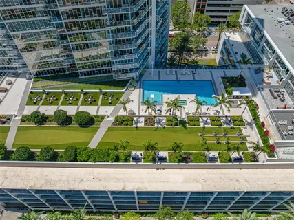 a view of a swimming pool with a lounge chairs