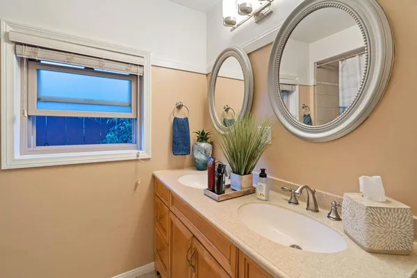 a bathroom with a shower and a window