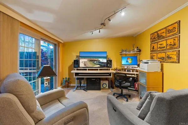 a living room with furniture and a window