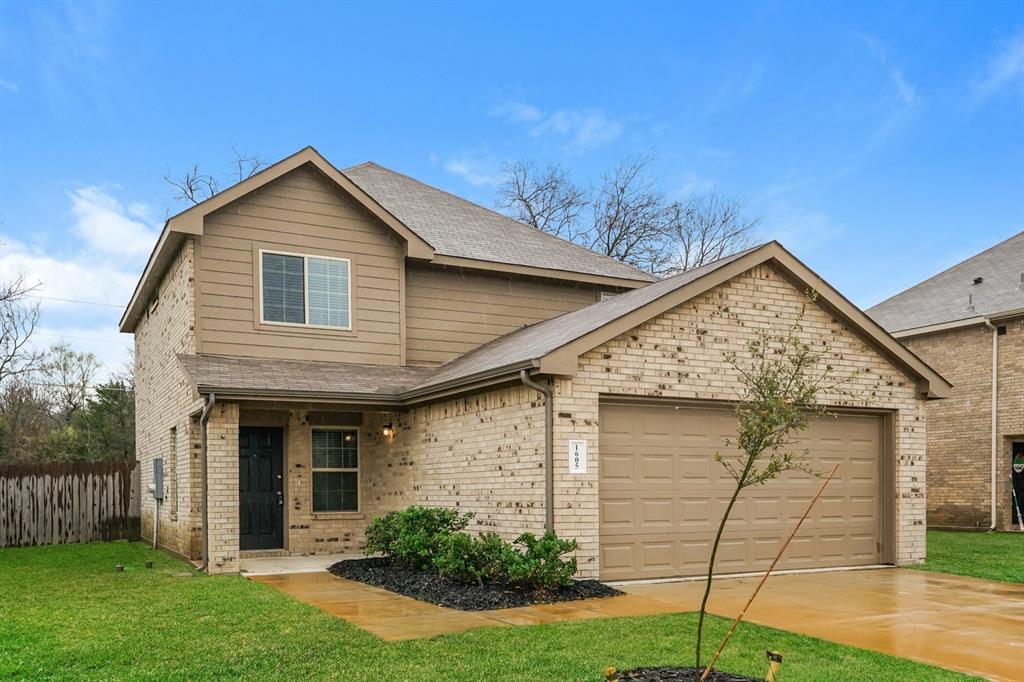 1605 Cardinal Drive Ennis, TX 75119 - Photo 2 of 16 a front view of a house with garden