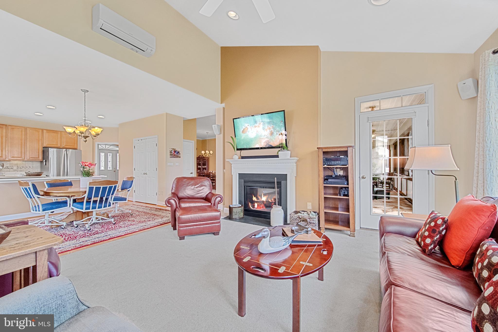 6051 Piney Grove Way Gainesville, VA 20155 - Photo 26 of 64 a living room with furniture and a fireplace