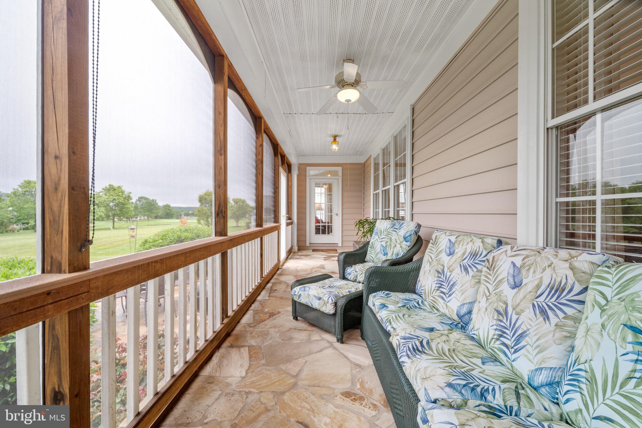 6051 Piney Grove Way Gainesville, VA 20155 - Photo 10 of 64 a balcony with furniture and a large window