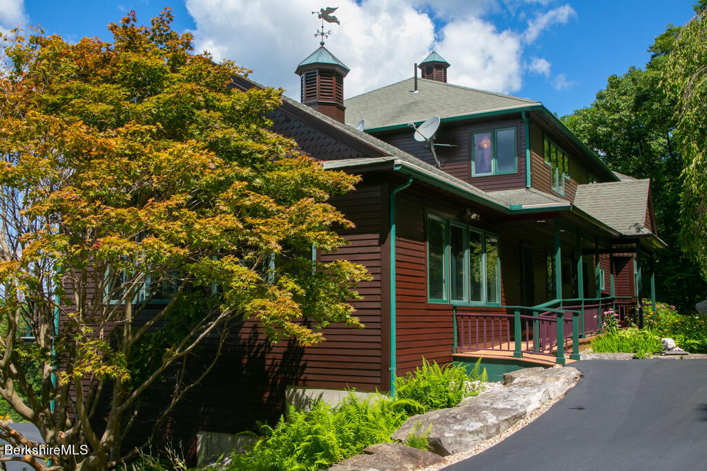 34 Sumner Mt Road Shutesbury, MA 01002 - Photo 6 of 62 a front view of a house with a yard