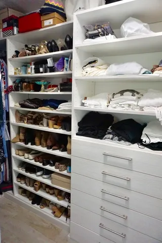 a kitchen with a cabinets and a shelf