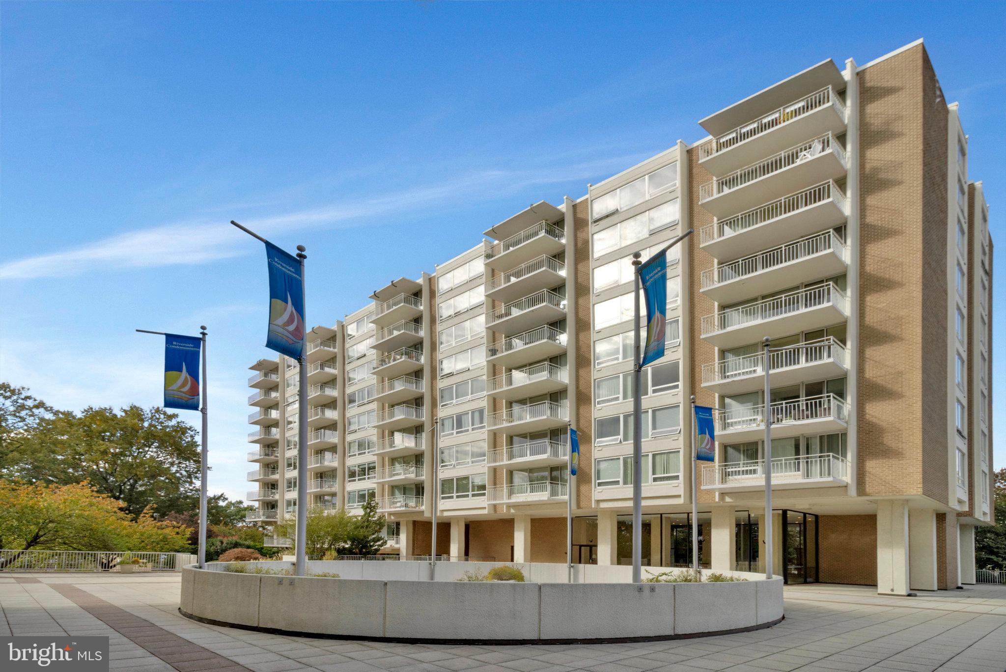 1425 4th Street Southwest, Unit A714 Washington, DC 20024 - Photo 12 of 15 Modern residential building with vibrant flags.