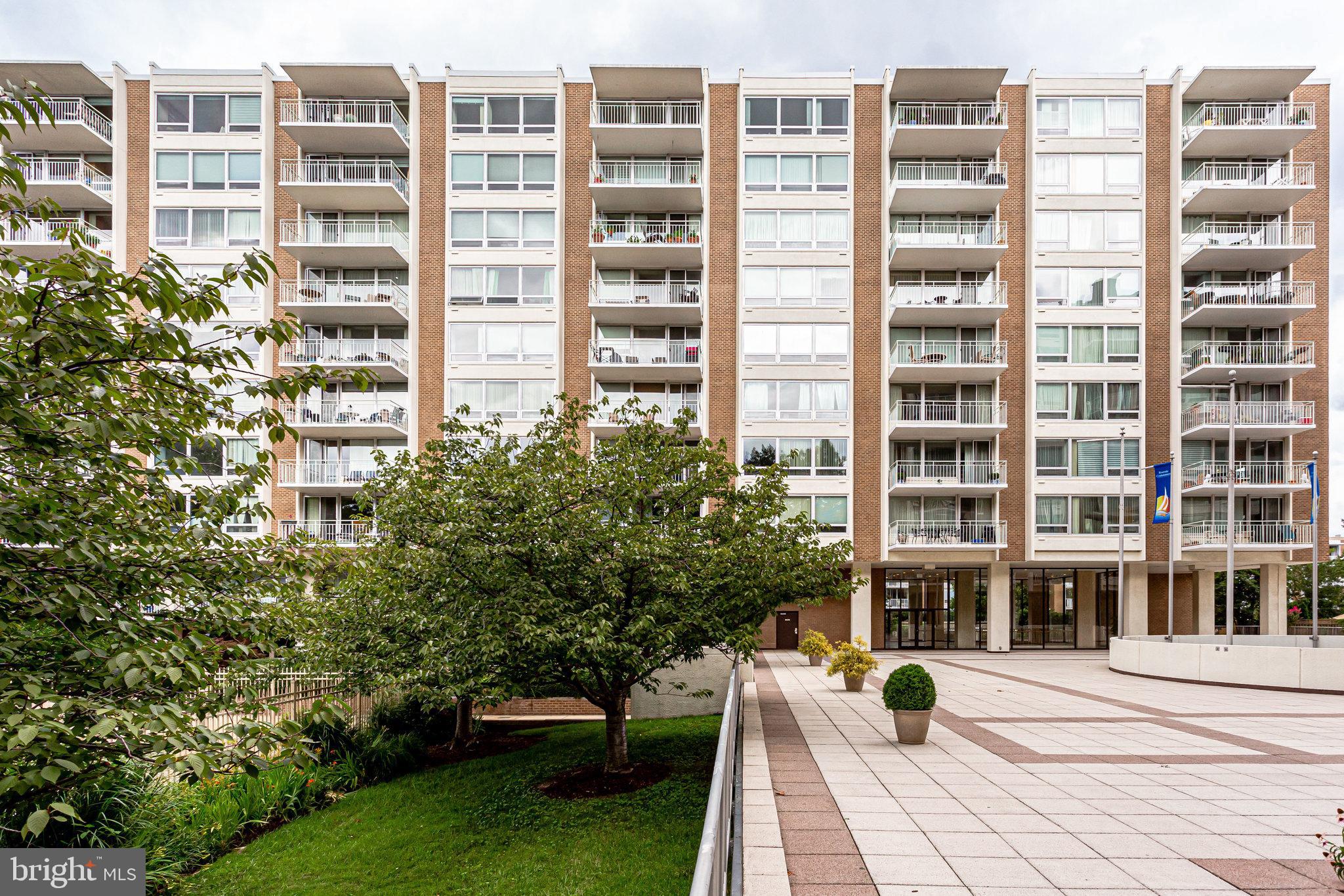 1425 4th Street Southwest, Unit A714 Washington, DC 20024 - Photo 13 of 15 Modern residential complex with lush greenery.