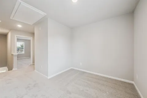an empty room with a bathroom