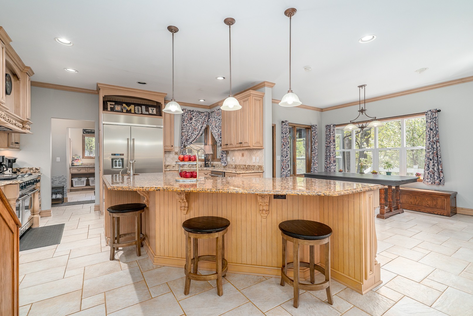 8500 North 4000 W Road Morris, IL 60450 - Photo 5 of 38 a kitchen with kitchen island a dining table chairs and a chandelier