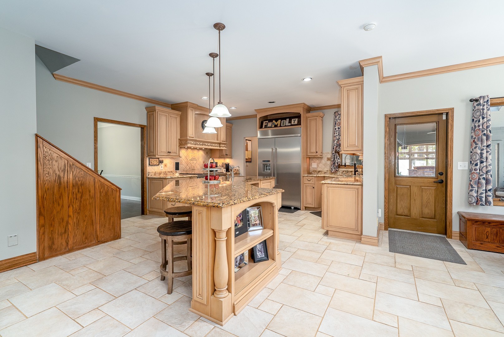 8500 North 4000 W Road Morris, IL 60450 - Photo 7 of 38 a open kitchen with stainless steel appliances kitchen island granite countertop a refrigerator and a sink